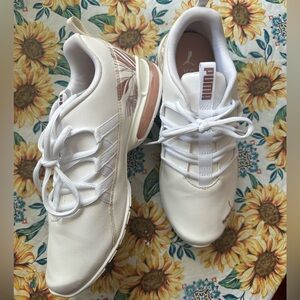 Puma never worn tennis shoes size 9 in women’s.